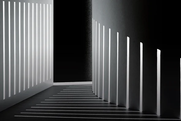 White architectural structure with bold shadows from sunlight