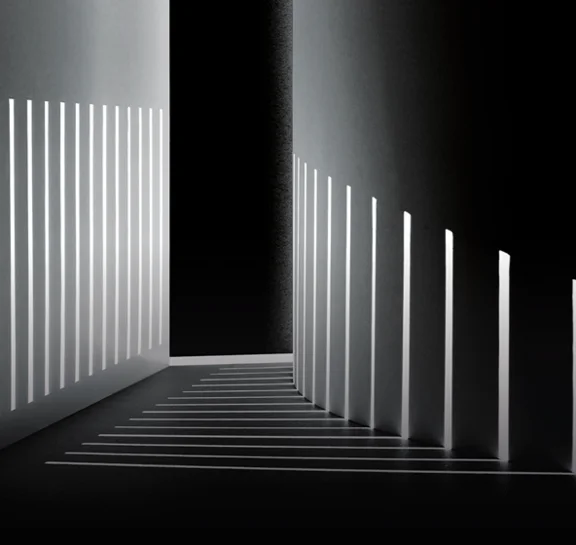 White architectural structure with bold shadows from sunlight